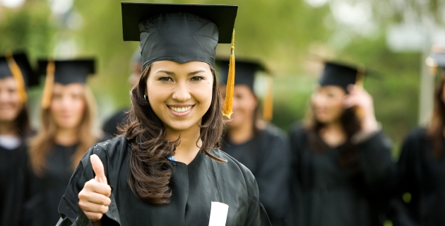 graduation girl holding her diploma with pride